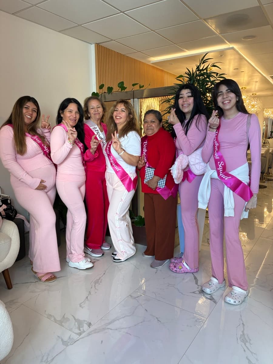 Bridesmaid squad in matching pink pajamas