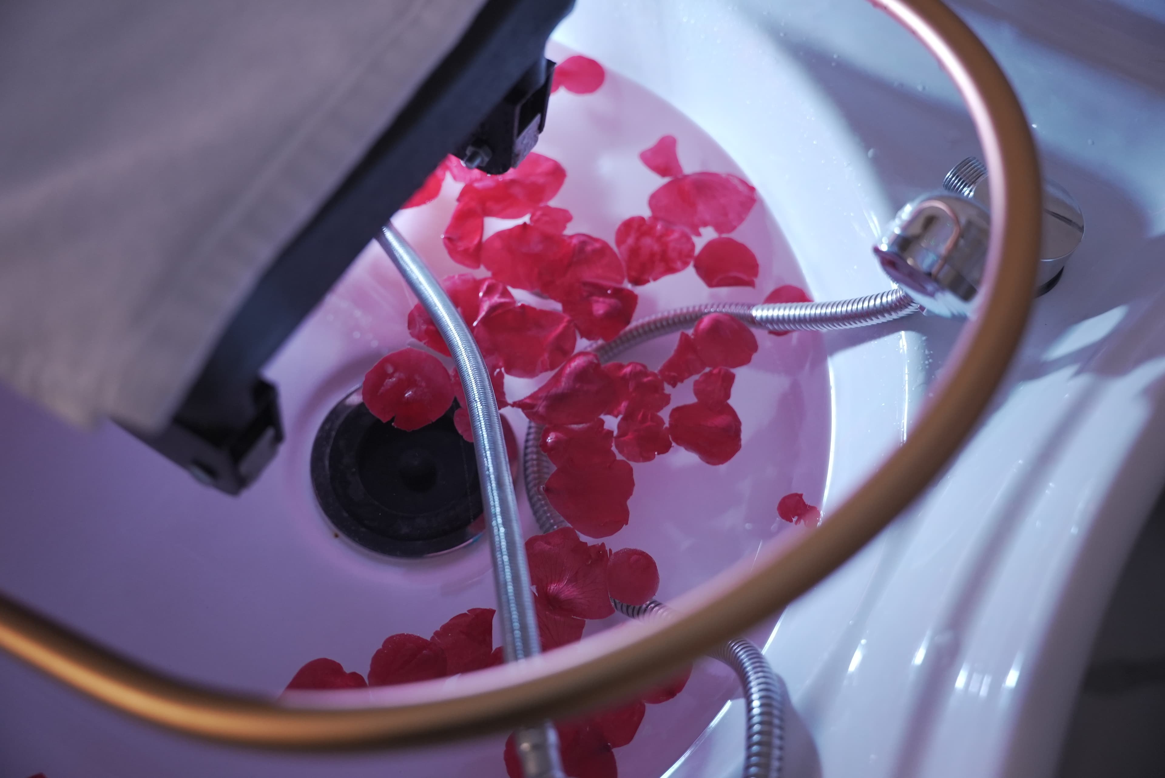 Treatment basin filled with rose petals