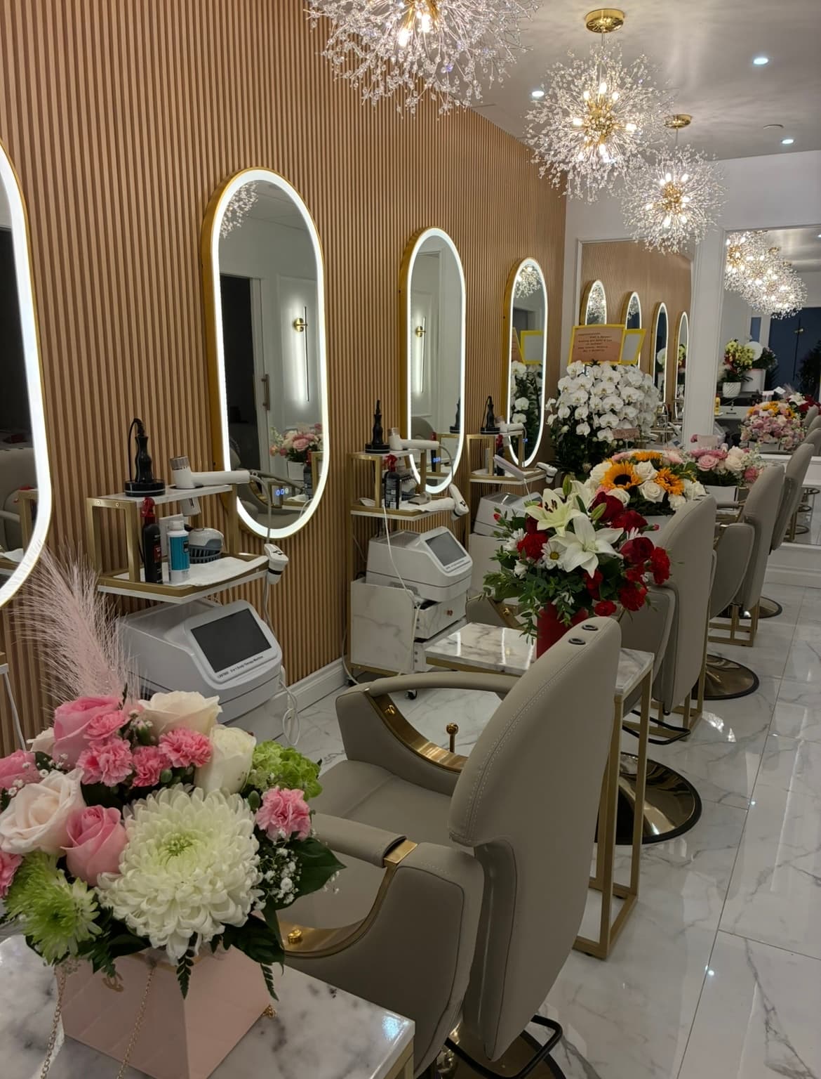 Lavie Bella salon floor with treatment stations and chandeliers